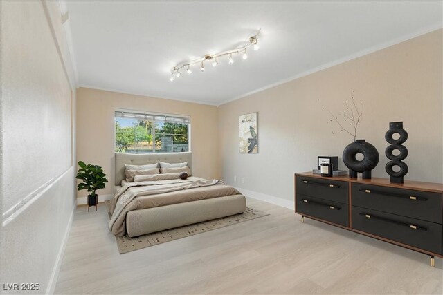2445 Antler Point Dr, Henderson, NV 89074 - bedroom with light wood-style flooring and crown molding