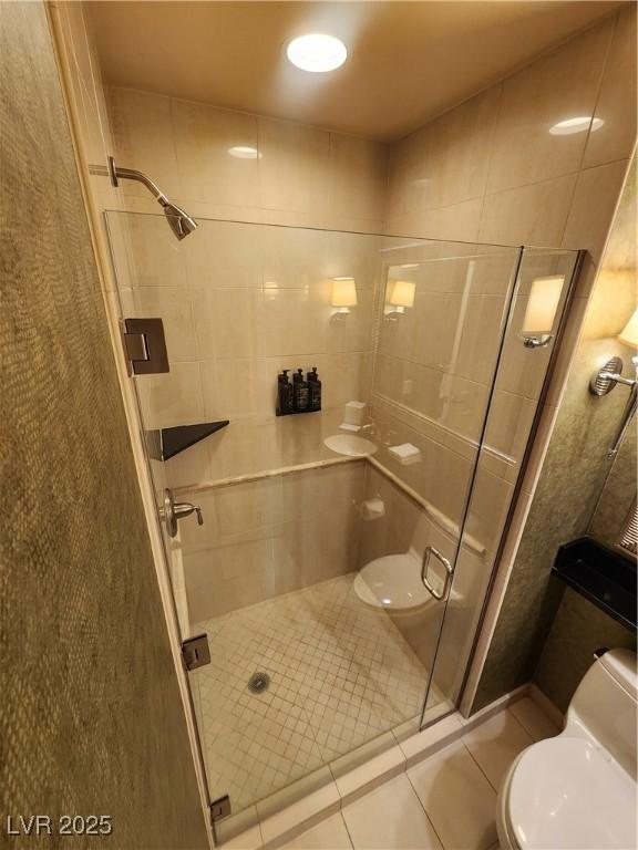 135 E Harmon Ave Unit 3320, Las Vegas, NV 89109 - full bathroom with toilet, a shower stall, and tile patterned floors