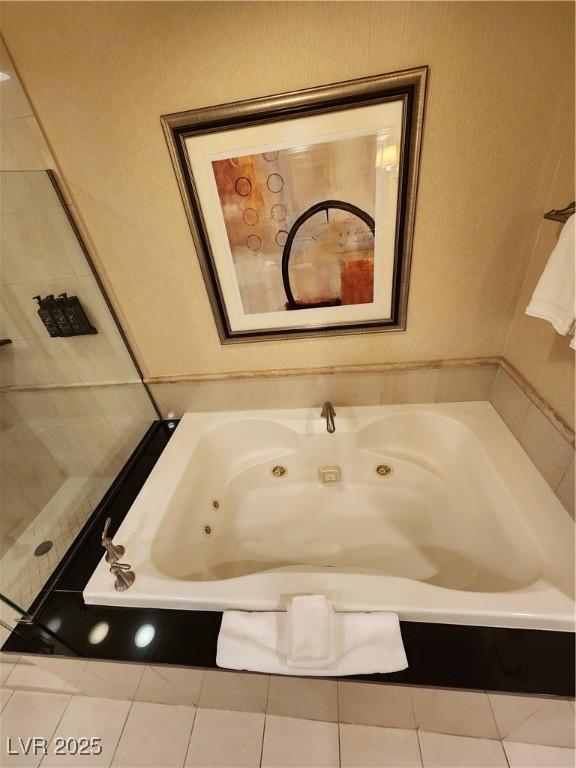135 E Harmon Ave Unit 3320, Las Vegas, NV 89109 - bathroom featuring a whirlpool tub and tile patterned flooring