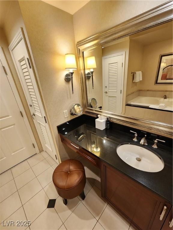 135 E Harmon Ave Unit 3320, Las Vegas, NV 89109 - bathroom featuring a closet, tile patterned flooring, and double vanity