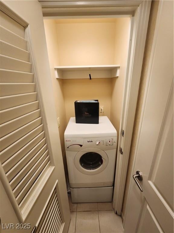 135 E Harmon Ave Unit 3320, Las Vegas, NV 89109 - laundry area featuring washer / clothes dryer and light tile patterned flooring