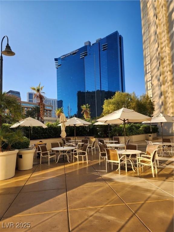 135 E Harmon Ave Unit 3320, Las Vegas, NV 89109 - view of patio with outdoor dining area