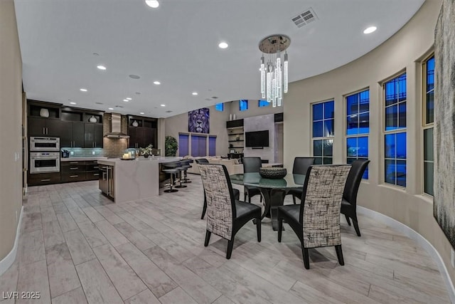 10 Olympia Outlook Dr, Las Vegas, NV 89141 - dining area with recessed lighting, an inviting chandelier, visible vents, and light wood-style flooring