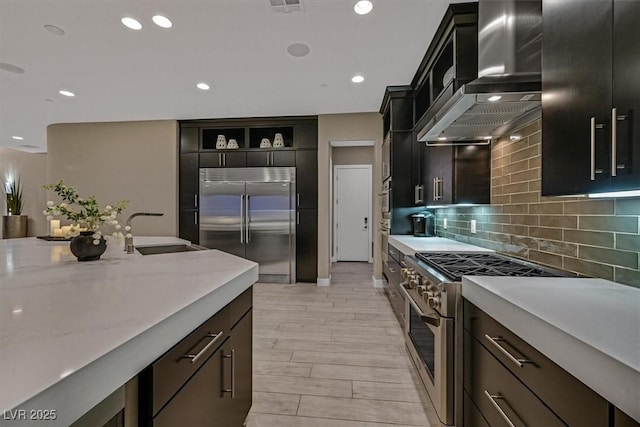 10 Olympia Outlook Dr, Las Vegas, NV 89141 - kitchen featuring a sink, open shelves, high quality appliances, wall chimney range hood, and light countertops