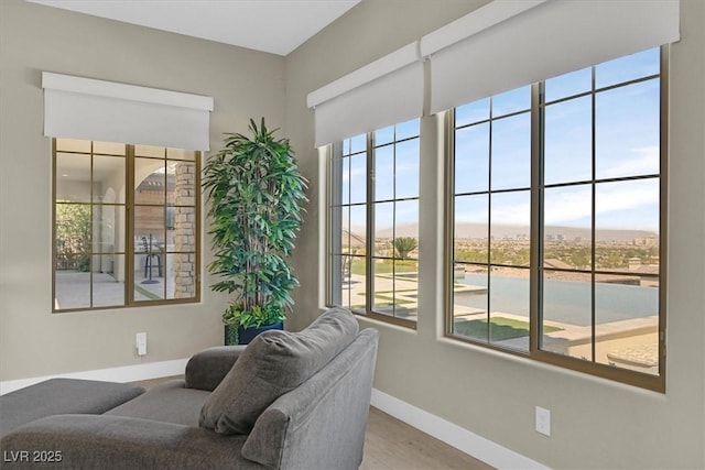 10 Olympia Outlook Dr, Las Vegas, NV 89141 - living area featuring baseboards and a healthy amount of sunlight