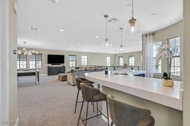 10 Olympia Outlook Dr, Las Vegas, NV 89141 - kitchen featuring a sink, recessed lighting, visible vents, and carpet