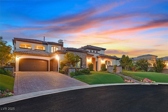 10 Olympia Outlook Dr, Las Vegas, NV 89141 - mediterranean / spanish-style house featuring stucco siding, driveway, a tiled roof, and a balcony