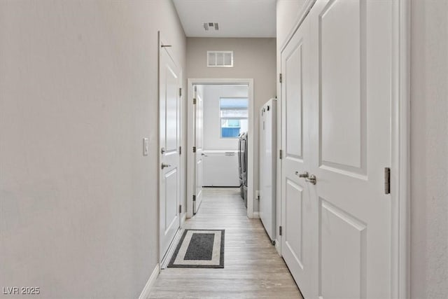 1225 Olivia Pkwy, Henderson, NV 89011 - hall with light wood-style flooring, baseboards, and visible vents