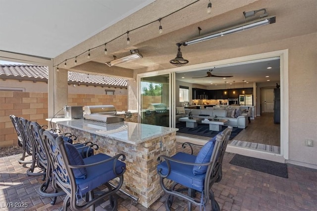 1225 Olivia Pkwy, Henderson, NV 89011 - view of patio featuring an outdoor kitchen, grilling area, fence, and outdoor wet bar