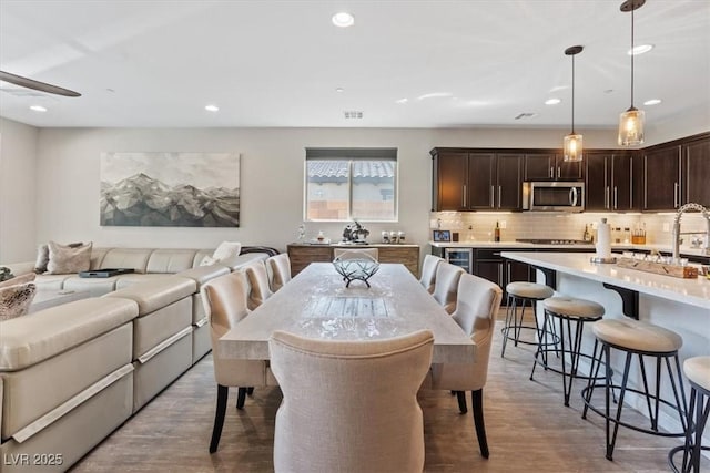 1225 Olivia Pkwy, Henderson, NV 89011 - dining space featuring light wood-style floors, visible vents, and recessed lighting