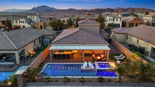 1225 Olivia Pkwy, Henderson, NV 89011 - exterior space with a fenced in pool, a residential view, a mountain view, a patio area, and a fenced backyard