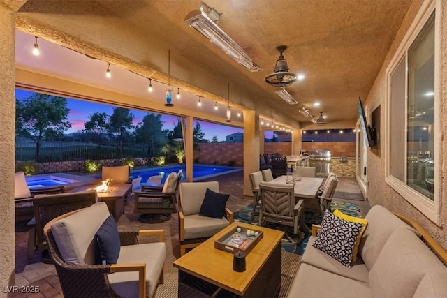 1225 Olivia Pkwy, Henderson, NV 89011 - patio terrace at dusk with an outdoor living space with a fire pit, outdoor dining space, a fenced backyard, and a fenced in pool
