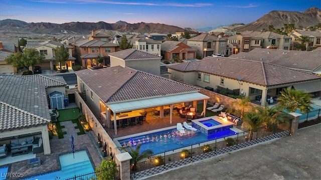 1225 Olivia Pkwy, Henderson, NV 89011 - aerial view at dusk with a mountain view and a residential view