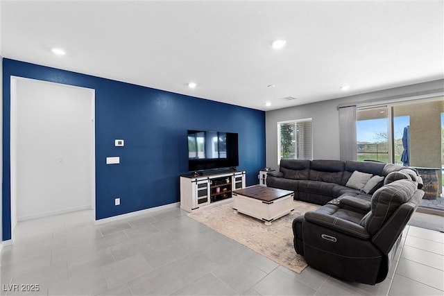 5455 Eleganza Ave, Pahrump, NV 89061 - living room featuring recessed lighting, visible vents, and baseboards