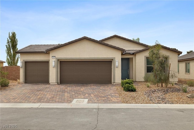 5455 Eleganza Ave, Pahrump, NV 89061 - single story home with a garage and stucco siding