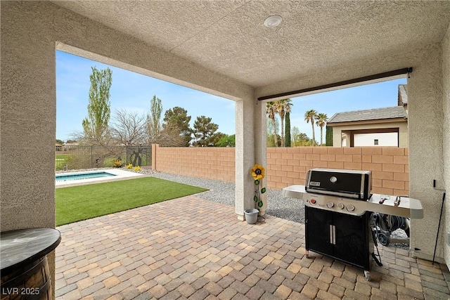 5455 Eleganza Ave, Pahrump, NV 89061 - view of patio featuring a fenced in pool, a fenced backyard, and a grill