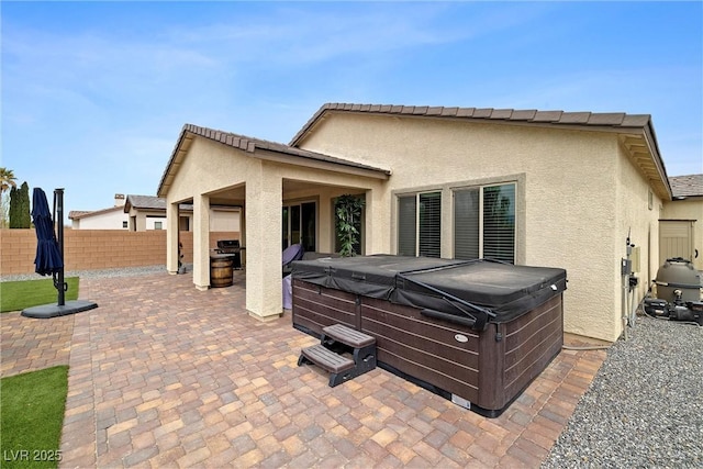 5455 Eleganza Ave, Pahrump, NV 89061 - exterior space featuring a patio area, stucco siding, fence, and a hot tub