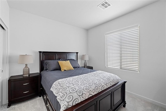 5455 Eleganza Ave, Pahrump, NV 89061 - bedroom with a closet, visible vents, light colored carpet, and baseboards