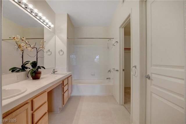 full bathroom with tile patterned floors, washtub / shower combination, a sink, and double vanity