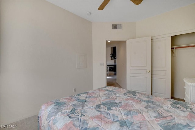 bedroom with a closet, ceiling fan, and visible vents