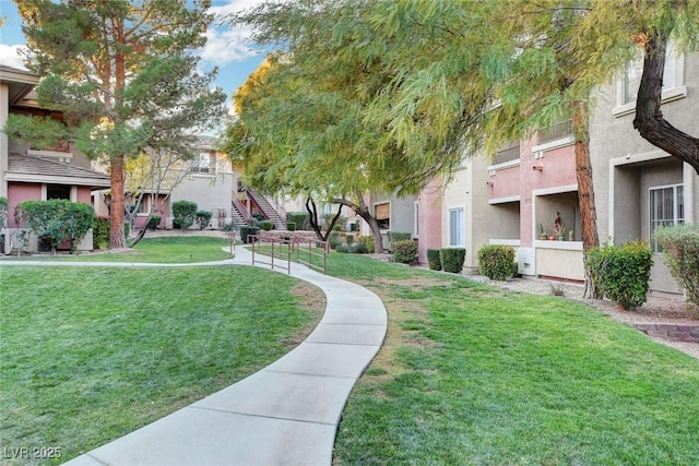 view of home's community featuring a residential view and a lawn