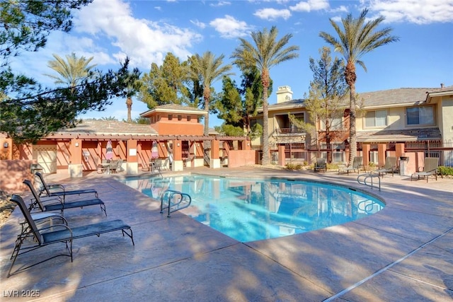community pool featuring a patio area