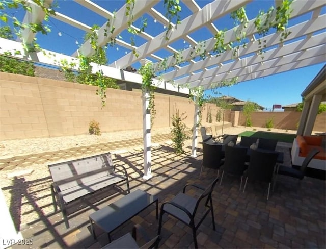 view of patio / terrace with a pergola and a fenced backyard