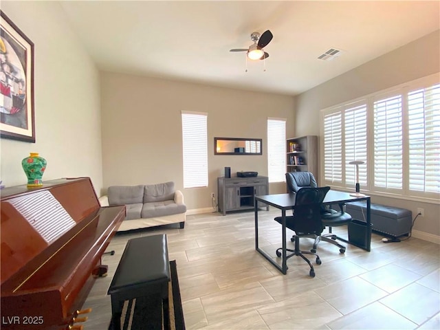 office space featuring ceiling fan, baseboards, and visible vents