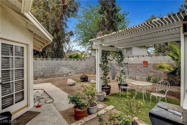 view of patio with a pergola and a fenced backyard