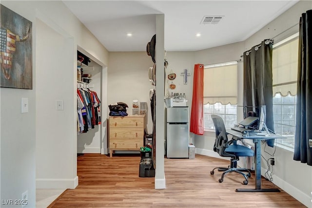 office space with wood finished floors, baseboards, visible vents, and recessed lighting