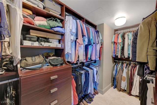 spacious closet featuring tile patterned floors