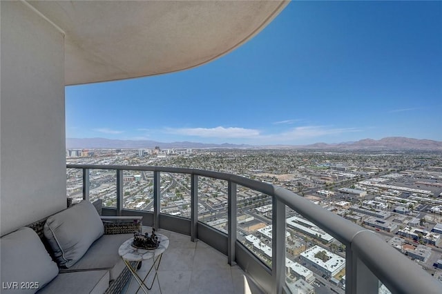 balcony with a city view and a mountain view