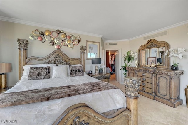 bedroom featuring a spacious closet, ornamental molding, and visible vents