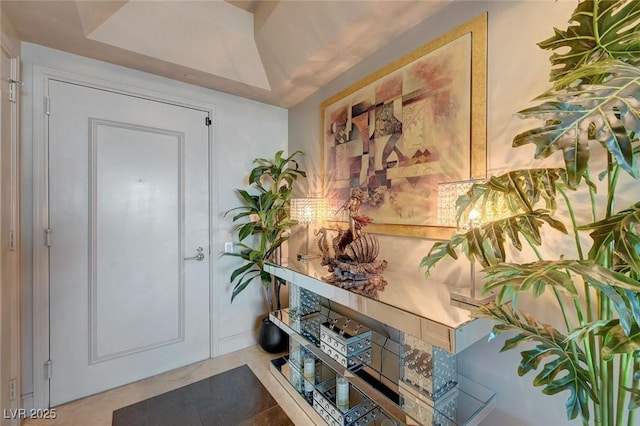 foyer featuring tile patterned flooring
