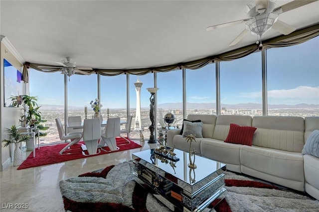 sunroom / solarium with a mountain view and expansive windows