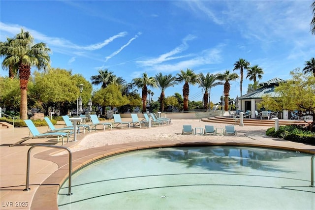 community pool featuring a gazebo and a patio area