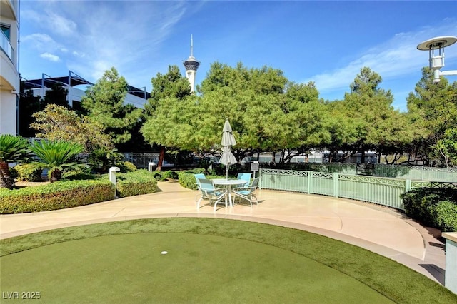 view of home's community featuring a patio and fence