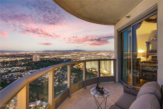 balcony with a view of city and a mountain view