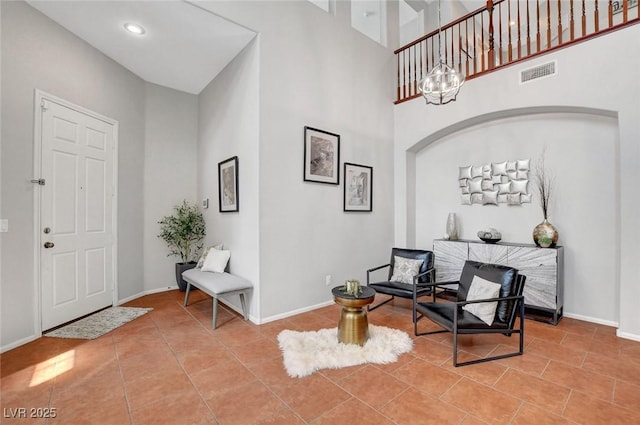 9413 Artesian Oak Ct, Las Vegas, NV 89149 - foyer with a towering ceiling, baseboards, visible vents, and tile patterned floors