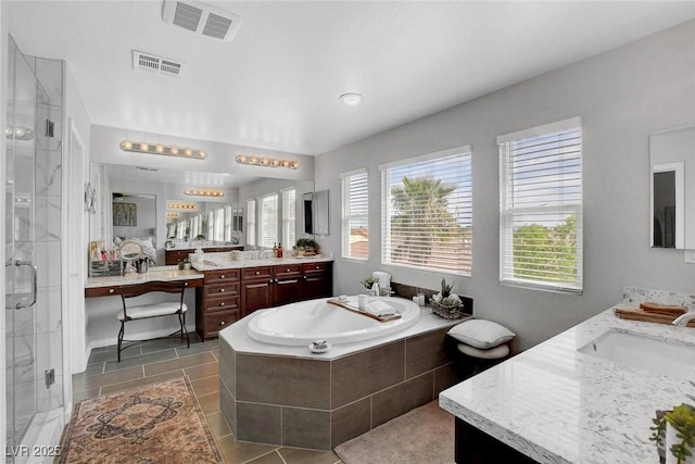 9413 Artesian Oak Ct, Las Vegas, NV 89149 - bathroom featuring visible vents, a wealth of natural light, and a shower stall