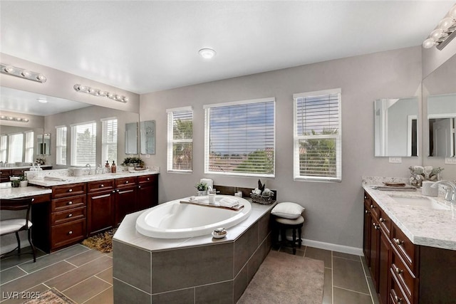 9413 Artesian Oak Ct, Las Vegas, NV 89149 - full bathroom with a bath, two vanities, tile patterned floors, and a sink