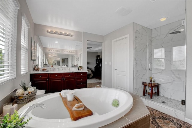 9413 Artesian Oak Ct, Las Vegas, NV 89149 - full bath featuring a garden tub, vanity, and a shower stall