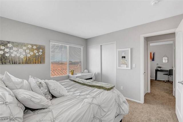 9413 Artesian Oak Ct, Las Vegas, NV 89149 - bedroom with light carpet, baseboards, and a closet