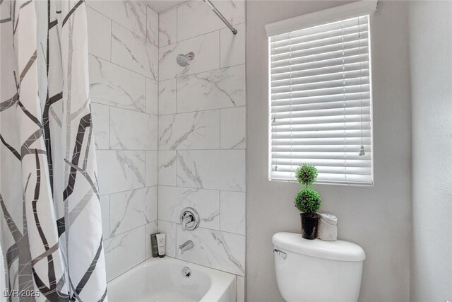 9413 Artesian Oak Ct, Las Vegas, NV 89149 - bathroom featuring toilet and shower / bathtub combination with curtain