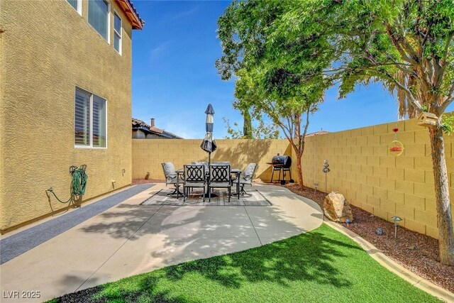 9413 Artesian Oak Ct, Las Vegas, NV 89149 - view of patio / terrace with a fenced backyard and a grill
