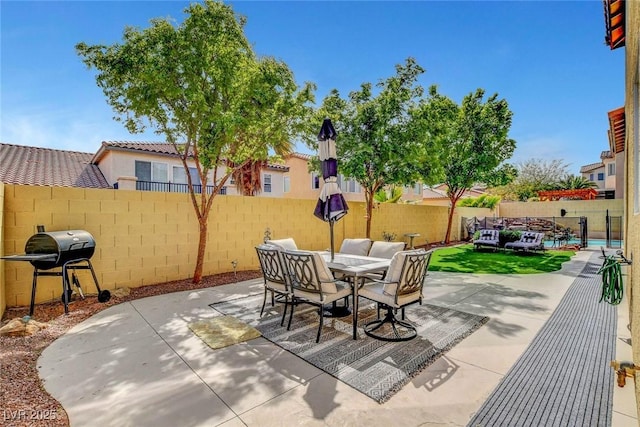 9413 Artesian Oak Ct, Las Vegas, NV 89149 - view of patio / terrace featuring a fenced backyard, area for grilling, and outdoor dining area