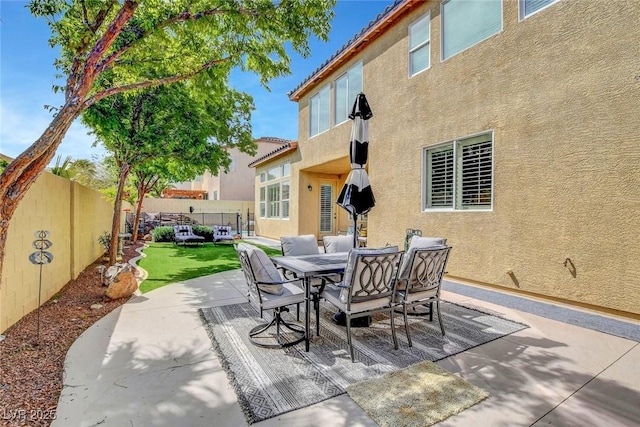 9413 Artesian Oak Ct, Las Vegas, NV 89149 - view of patio / terrace with outdoor dining area and a fenced backyard