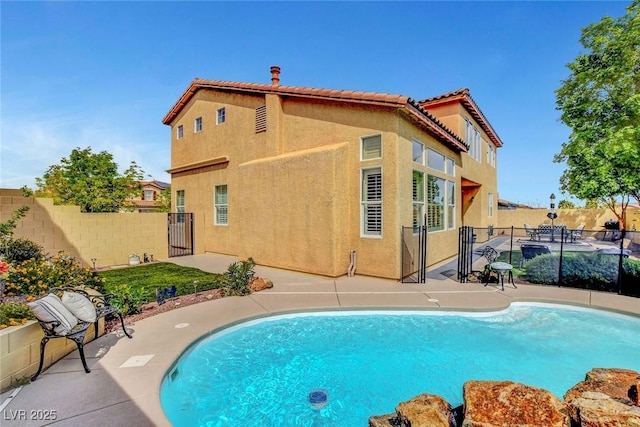 9413 Artesian Oak Ct, Las Vegas, NV 89149 - view of swimming pool with fence, a fenced in pool, a gate, and a patio