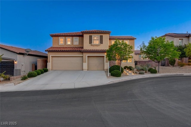 9413 Artesian Oak Ct, Las Vegas, NV 89149 - mediterranean / spanish home with stucco siding, a tiled roof, concrete driveway, and a garage