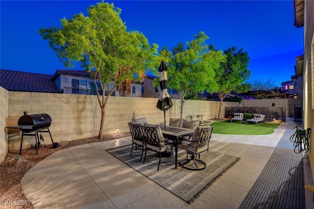 9413 Artesian Oak Ct, Las Vegas, NV 89149 - view of patio with a fenced backyard, outdoor dining area, and a grill